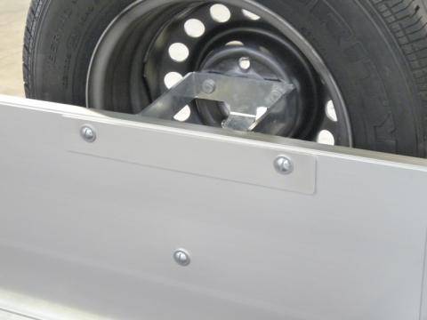 Spare wheel carrier installed on the headboard