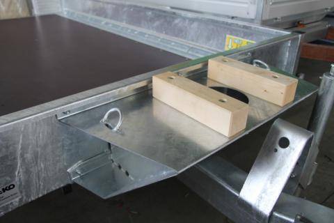 Support for excavator arm on drawbar