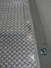 Aluminium chequer plate floor mounted on phenol-coated board floor, pe